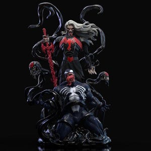 May include: A detailed statue featuring two comic book characters, Venom and a figure with white hair and a red sword. Venom is in a kneeling pose, with a white spider emblem on his chest. The other figure is in a black outfit with a red emblem.