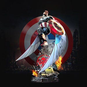May include: A detailed statue of a superhero in a red, white, and blue costume, with a shield and wings. The figure is posed in front of a shield emblem, with flames and a city skyline in the background.
