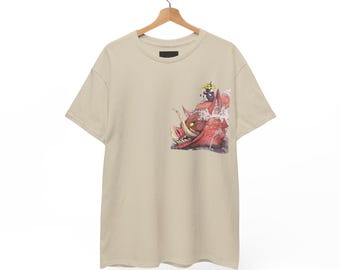 May include: A beige short-sleeved t-shirt featuring a graphic print on the chest. The illustration depicts a large red boar with prominent tusks and glowing yellow eyes, with a small dark figure sitting atop its head.