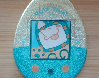 Pin con forma de huevo brillante de Sphinx Tenna-gotchi