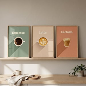 May include: Three framed art prints featuring coffee drinks: Espresso, Latte, and Cortado. Each print has a different background color and a minimalist illustration of the drink. The Espresso print is on a green background, the Latte on a beige background, and the Cortado on an orange background.