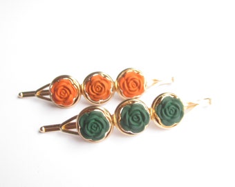 Color choice of a hair clip in orange or dark green