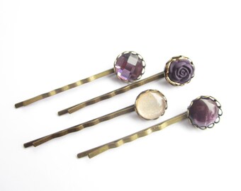 Set of 4 hair clips in purple and gold tones