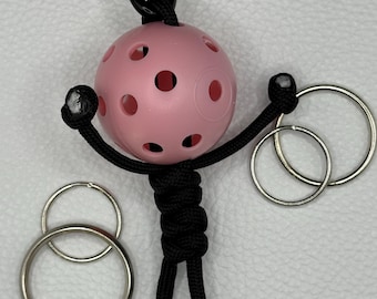 Llavero de paracord hecho a mano para pickleball – Adorno deportivo para bolso y tirador de cremallera - Negro y rosa