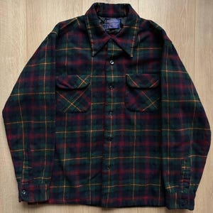 May include: A set of three ceramic mugs with a speckled, matte finish. The mugs are in shades of cream, light gray, and dark gray. Each mug has a simple, minimalist design, perfect for coffee or tea.