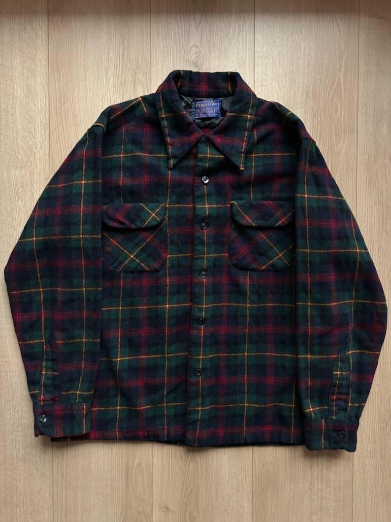 May include: A set of three ceramic mugs with a speckled, matte finish. The mugs are in shades of cream, light gray, and dark gray. Each mug has a simple, minimalist design, perfect for coffee or tea.