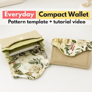 May include: Two compact wallets, one open and one closed, featuring a beige exterior and a floral interior pattern with white, green, and red accents. The text "Everyday Compact Wallet Pattern template + tutorial video" is displayed above the items.