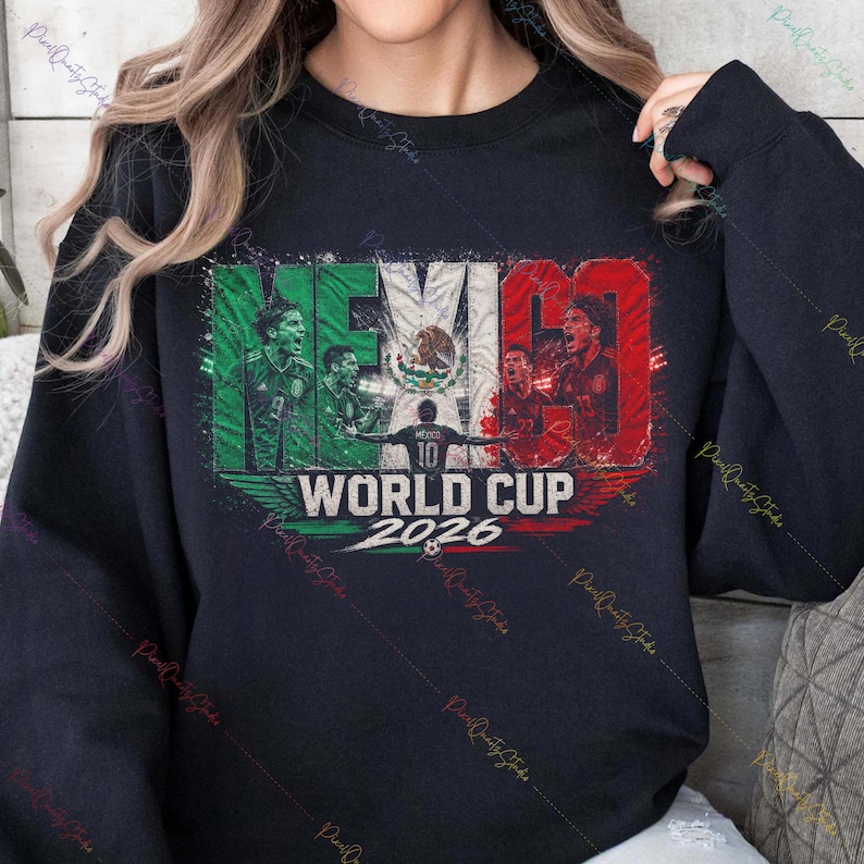 May include: A black crewneck sweatshirt featuring a graphic print of the Mexican flag with the text MEXICO WORLD CUP 2026. The design includes illustrations of soccer players in action and a central soccer ball icon in a distressed style.