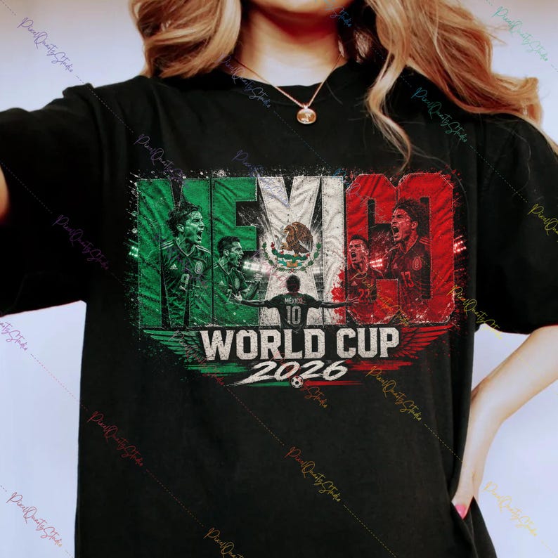 May include: A black t-shirt featuring a graphic print with the text MEXICO WORLD CUP 2026. The design incorporates the colors of the Mexican flag, images of soccer players, and the national emblem, set against a distressed, textured background.