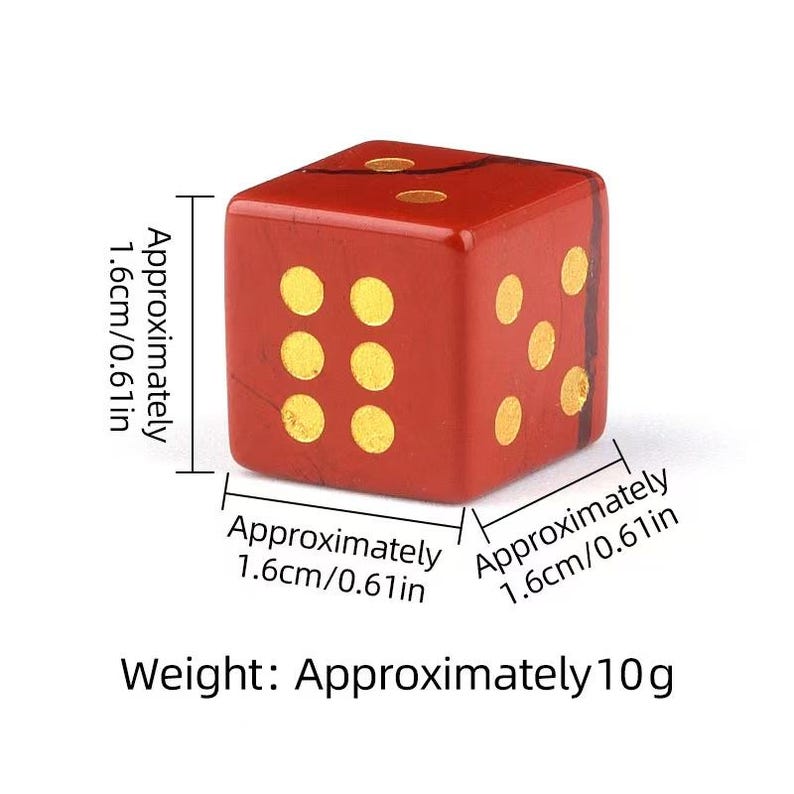 May include: A red die with gold dots, approximately 0.61 inches (1.6 cm) on each side and weighing approximately 10 grams. The die has six sides with a different number of dots on each side.