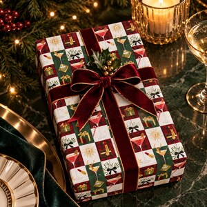 May include: A rectangular gift box wrapped in paper with a checkered pattern of red, green, and white squares featuring illustrations of cocktails, gifts, and stars. The box is tied with a deep red velvet ribbon and topped with a holly sprig.