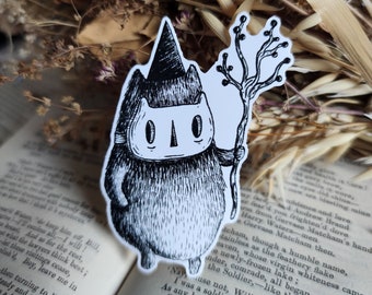 Könnte beinhalten: Schwarz-weiß-Illustration einer Katze, die einen Hexenhut trägt und einen Stock hält. Die Katze hat eine Maske über den Augen und einen kleinen, spitzen Hut. Die Katze steht auf einem weißen Hintergrund.