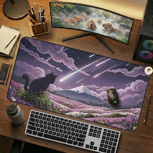 May include: A large rectangular mouse mat with a black cat, a mountain, and a field of purple flowers under a starry sky. A computer keyboard, mouse, and monitor are also visible.