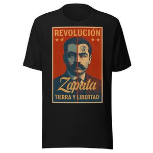 May include: Black t-shirt featuring a vintage-style graphic of a man with a large mustache, split face, and the word "Zapata" in gold. The text "REVOLUCIÓN" and "TIERRA Y LIBERTAD" are also displayed.