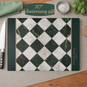 May include: A rectangular cutting board featuring a diamond-patterned design of white and dark green marble tiles. The right side includes a dark green border with the gold text Forever & Always 20 years. A thin gold line separates the patterns.