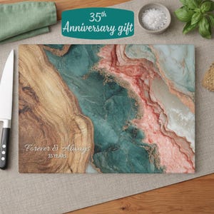 May include: A rectangular cutting board with a marbled design in shades of brown, teal, and pink. The text "Forever & Always 35 YEARS" is printed on the board. The words "35th Anniversary gift" are on a teal banner.