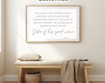 May include: A framed print with the text "THE LORD IS MY SHEPARD" in a light wood frame. The print is above a wooden bench with a pillow, a woven basket, and a draped blanket. The word "Customize" is at the top.