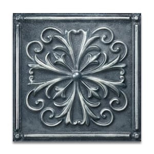 May include: A square, decorative ceiling tile with a detailed, symmetrical floral design. The raised pattern is in a silver color, set against a dark gray background. The tile has a framed border.