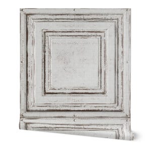 May include: White and brown distressed wallpaper roll featuring a square panel design. The wallpaper has a textured appearance with a subtle dotted pattern and a weathered, vintage aesthetic. The design includes layered square frames with a distressed finish.