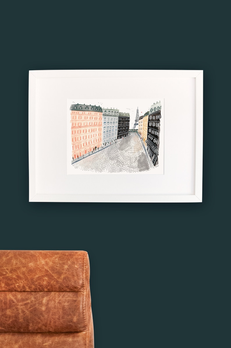 May include: A watercolor illustration of a Parisian street scene with buildings on either side of a cobblestone street. The Eiffel Tower is visible in the distance.