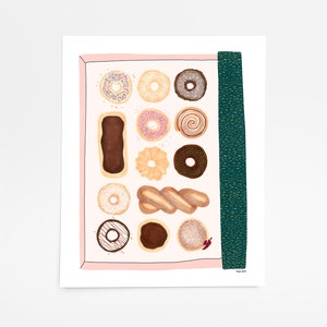 May include: A pink box filled with a variety of donuts, including glazed, chocolate, sprinkle, and jelly donuts. The box is decorated with a green and gold stripe.