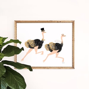 May include: A framed illustration of two ostriches running. The ostrich on the left is wearing a top hat and bow tie. The ostrich on the right is wearing a pearl necklace and a crown. The background is white.