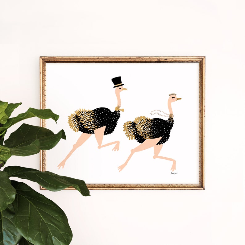 May include: A framed illustration of two ostriches running. The ostrich on the left is wearing a top hat and bow tie. The ostrich on the right is wearing a pearl necklace and a crown. The background is white.