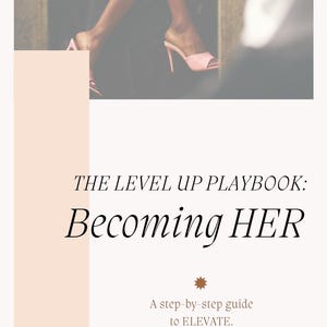 May include: The image features a book cover with the title "THE LEVEL UP PLAYBOOK: Becoming HER." The cover has a light peach color scheme with a photo of pink high-heeled sandals. The text "A step-by-step guide to ELEVATE" is also included.