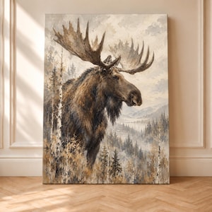 May include: A vertical canvas wall art print featuring a large brown moose with prominent antlers standing in a forest of birch and pine trees. The background displays a misty mountain landscape in muted tones of beige, grey, and brown.