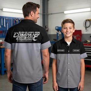 May include: Two-tone work shirts in black and gray, with short sleeves. The shirts have text that reads "SLOGAN GOES HERE", "COMPANY", "NAME HERE", and a phone number. One shirt has "DEPARTMENT" and "YOUR NAME" labels.