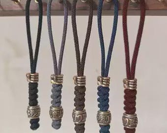Hand-Carved Tibetan Six-Syllable Mantra Brass Fist Lanyard Bead | EDC Knife Charm, Slingshot Pendant, Paracord Keychain Accessory
