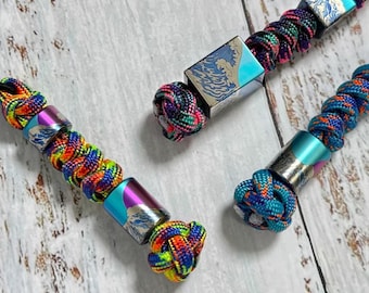 Japanese Wave Lanyard Bead, hand-carved from titanium alloy, and comes with a free paracord lanyard