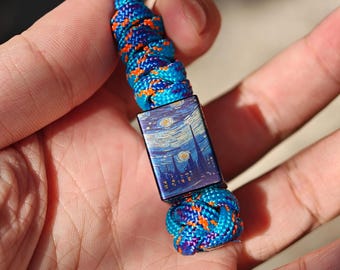 Starry Sky Lanyard Bead, met de hand gesneden uit titaniumlegering, en wordt geleverd met een gratis paracord keycord
