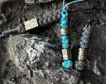 Skull lanyard bead, hand-carved from titanium alloy, and comes with a free paracord lanyard