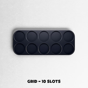 May include: A dark navy blue grid with ten circular slots, perfect for organizing small items. The text "GRID - 10 SLOTS" is printed in black at the bottom of the image. The grid has rounded corners and is set against a white background.