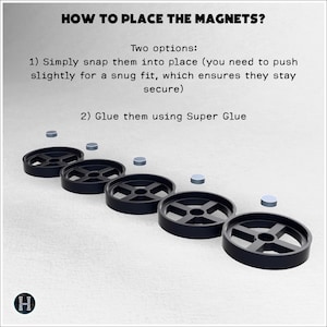 May include: Diagram illustrating how to place magnets. Text reads "HOW TO PLACE THE MAGNETS?" and "Two options: 1) Simply snap them into place... 2) Glue them using Super Glue." The image shows black circular objects and small silver magnets.