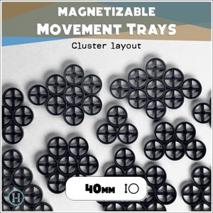May include: Black magnetizable movement trays arranged in a cluster layout. The trays are circular with a cross design and are 4cm in diameter. The image features the text "MAGNETIZABLE MOVEMENT TRAYS" and "Cluster layout".