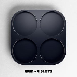 May include: A dark navy blue grid with four circular slots. The grid has rounded corners and is set against a white background. The text "GRID - 4 SLOTS" is displayed in black at the bottom of the image.