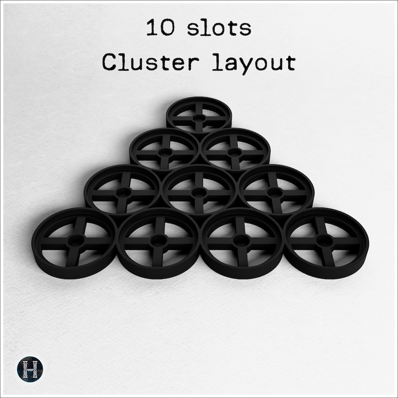 May include: Black, circular objects with a cross-shaped design are arranged in a pyramid shape. The image includes the text "10 slots Cluster layout". The objects are on a white background.