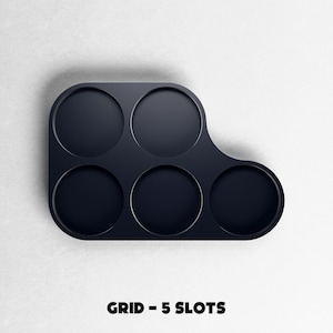 May include: A dark navy blue grid with five circular slots. The grid has a curved shape on one side and is labeled "GRID - 5 SLOTS" in bold, white text at the bottom. The object is set against a white background.