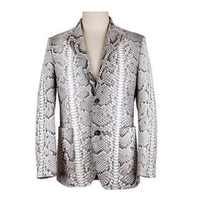 May include: A blazer featuring a grey, black, and white snakeskin pattern. The garment has a notched lapel, long sleeves, two front pockets, and a two-button closure on the front. The design displays a consistent scale texture throughout the fabric.