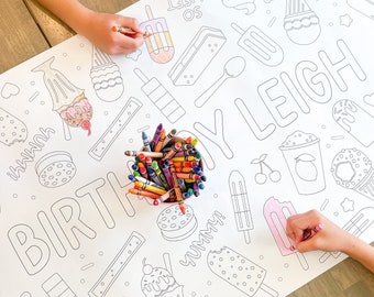 Puede incluir: Una página para colorear blanca con un tema de cumpleaños con conos de helado, paletas de hielo y el nombre "Kylie Leigh". La página está decorada con una variedad de otros diseños divertidos, incluyendo corazones, estrellas y cerezas. Una caja de crayones está sentada en la página, lista para ser utilizada para colorear los diseños.