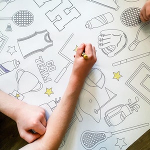 A black and white coloring page featuring various sports equipment, including a baseball glove, a golf club, a lacrosse stick, a tennis racket, a basketball, a soccer ball, and a trophy. The page also includes the words "Go Team" and a star.