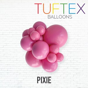 May include: A cluster of pink balloons in various sizes against a white brick wall. The word "Tuftex Balloons" is written in colorful letters at the top, and the word "Pixie" is at the bottom.