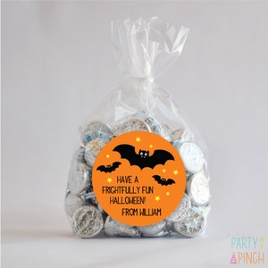 May include: Orange and black Halloween treat bag with a round sticker that says "Have a frightfully fun Halloween! From William" with a black bat and yellow stars.