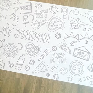 A white coloring sheet with a pizza theme. Outlined illustrations include pizza slices, a pizza box, a bottle, and the text "Pizza is Life." The name "Jordan" is also featured.