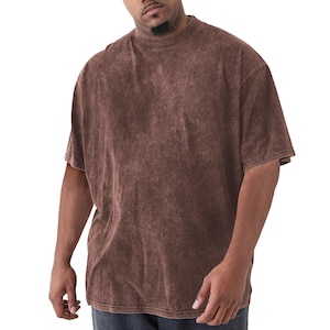 May include: A brown, short-sleeved t-shirt with a crew neck. The shirt has a faded, textured appearance. The garment is a relaxed fit, suitable for casual wear.