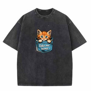 May include: A white ceramic mug with a black handle and the text "But First, Coffee" in a handwritten style. The mug is on a white surface. The mug is approximately 4 inches tall.