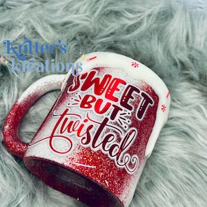 May include: Red and white glitter mug with the text "Sweet But Twisted" in white lettering. The mug has a white rim and a white handle.