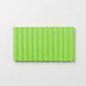 May include: A rectangular, lime green yoga mat with vertical ribbed texture. The mat is made of a flexible material and is designed for exercise and stretching. The bright color adds a vibrant touch to any workout space.